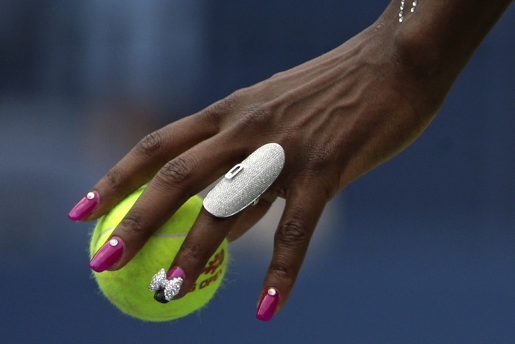 Американская теннисистка Винус Уильямс во время матча против бельгийки Кирстен Флипкенс на U.S. Open, Нью-Йорк.